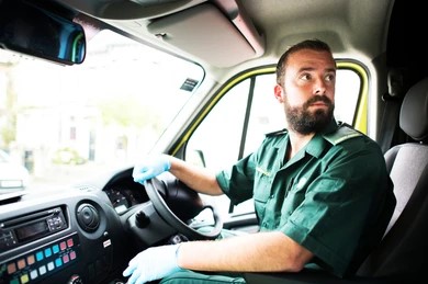 male-paramedic-driving-ambulance-260nw