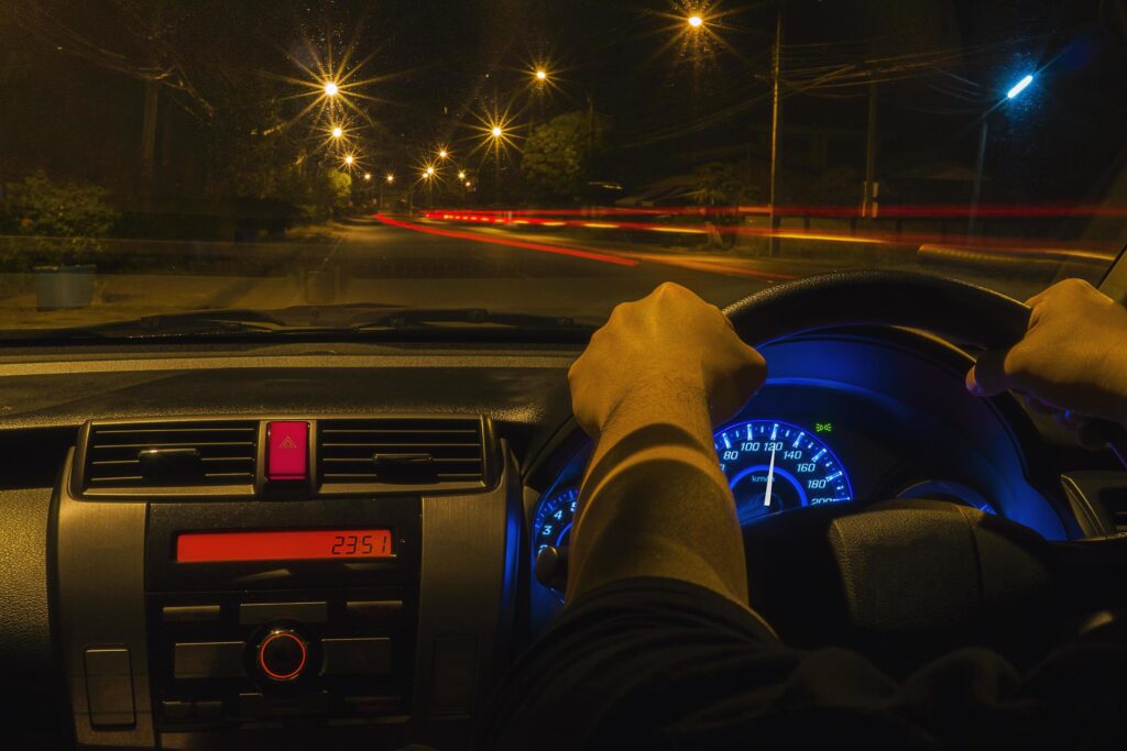 man-driving-car-in-a-night-time-left-driving-countries-free-photo